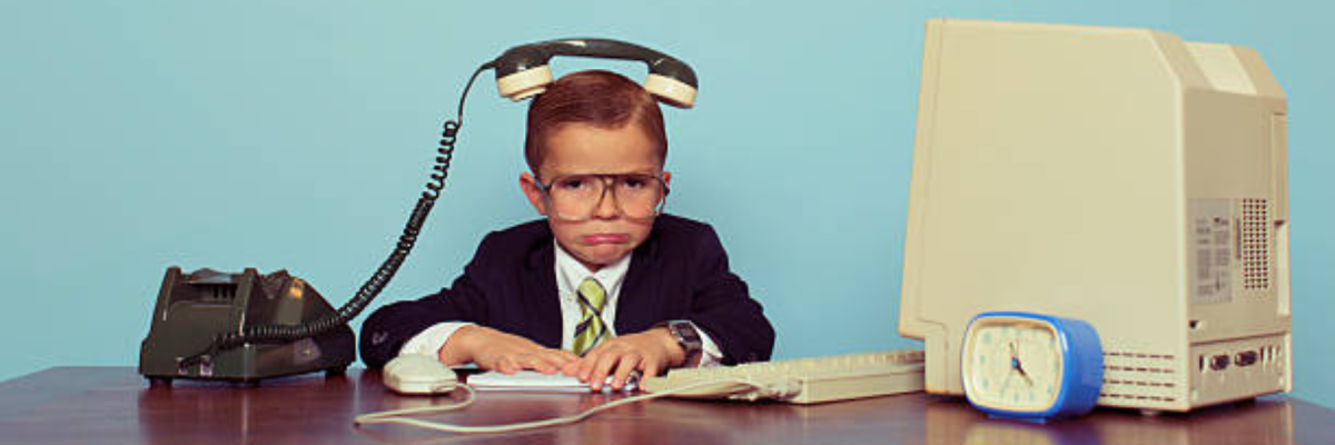 Young Boy Businessman with Telephone on His Head