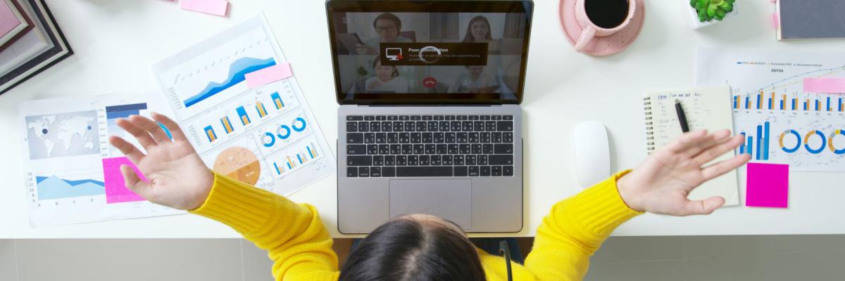 overhead view of connection issues on laptop, frustrated employee